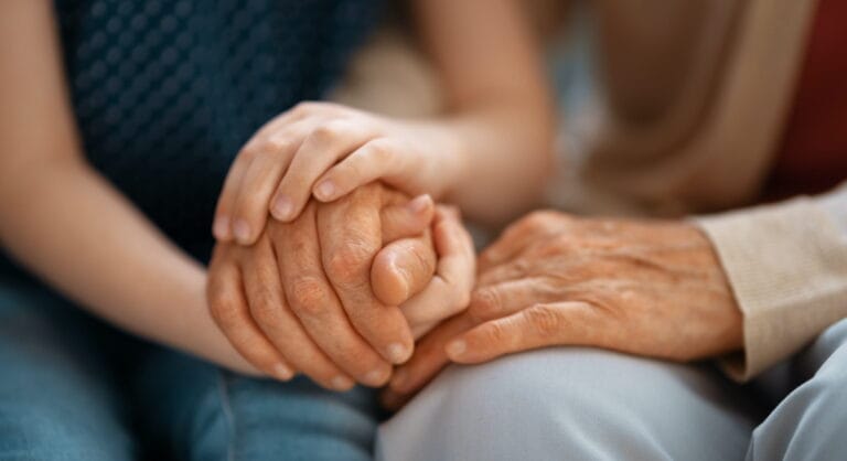 Granddaughter supporting her grandmother